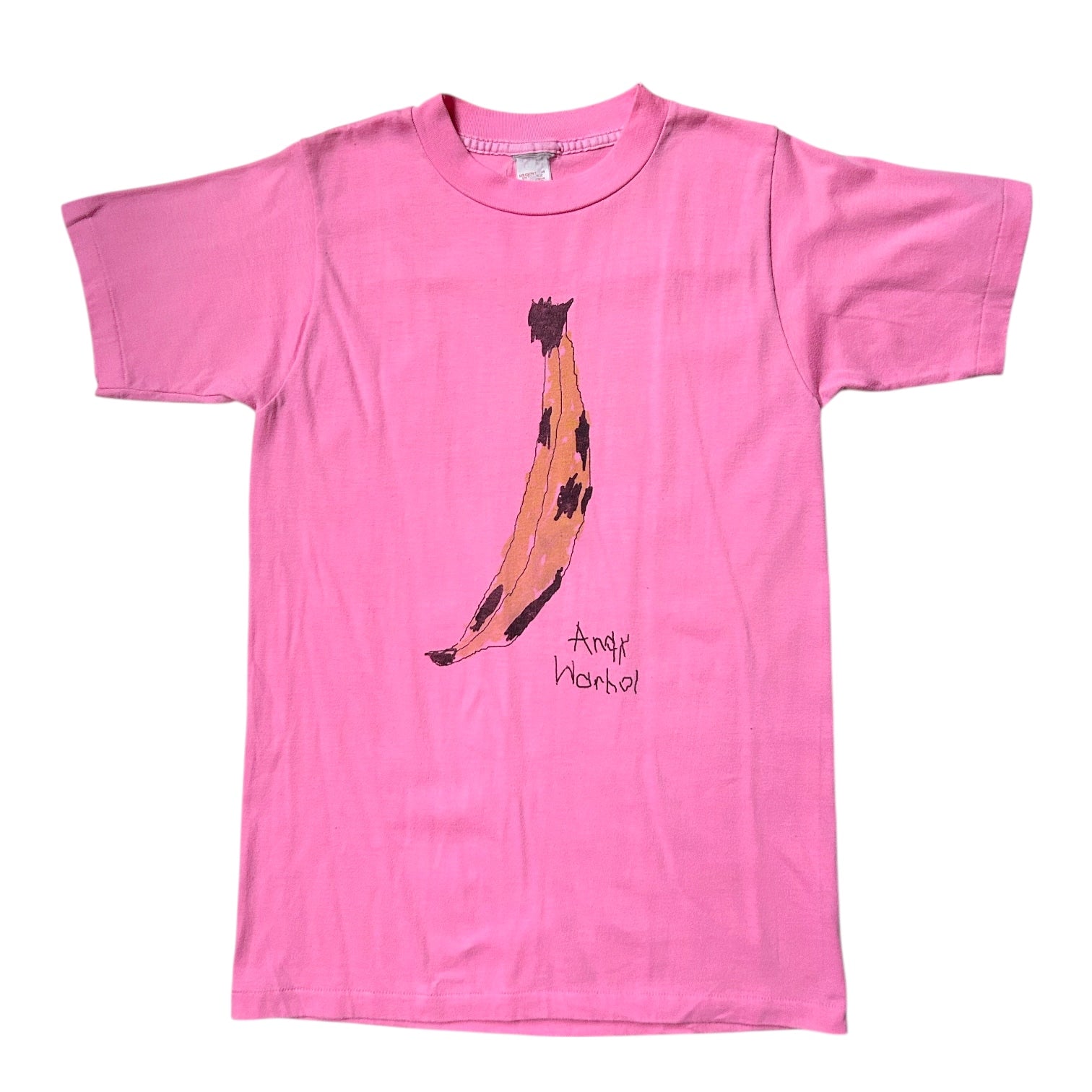 Pink t-shirt with a banana graphic and 'Andy Warhol' text on a white background